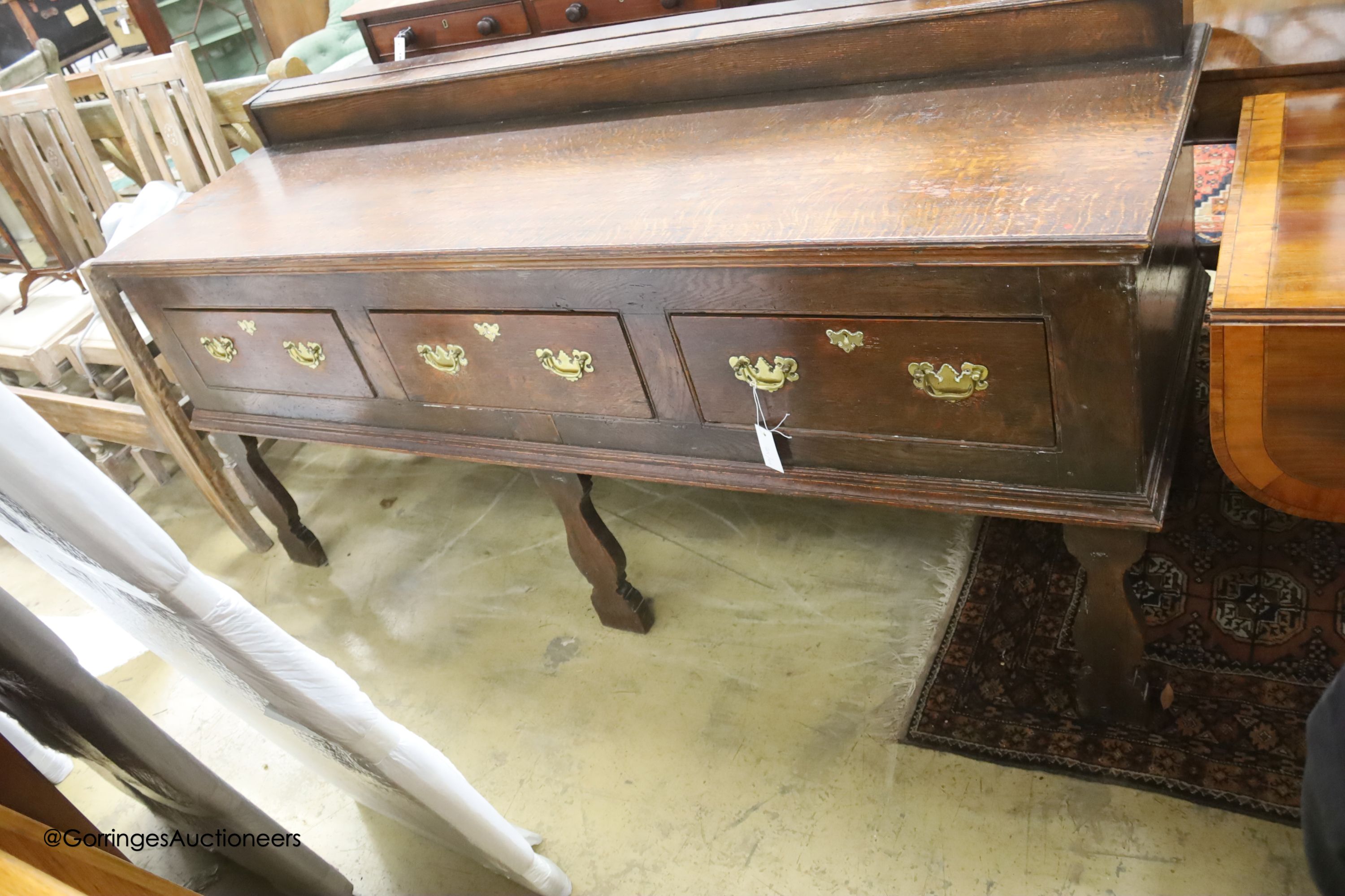 An 18th century oak low dresser, length 182cm, depth 58cm, height 90cm